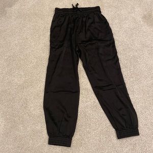 Brand new! Shiny black joggers with pockets